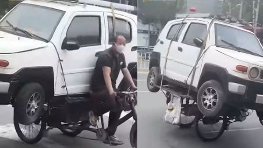 Посмотрите, как китаец перевозил автомобиль на велосипеде